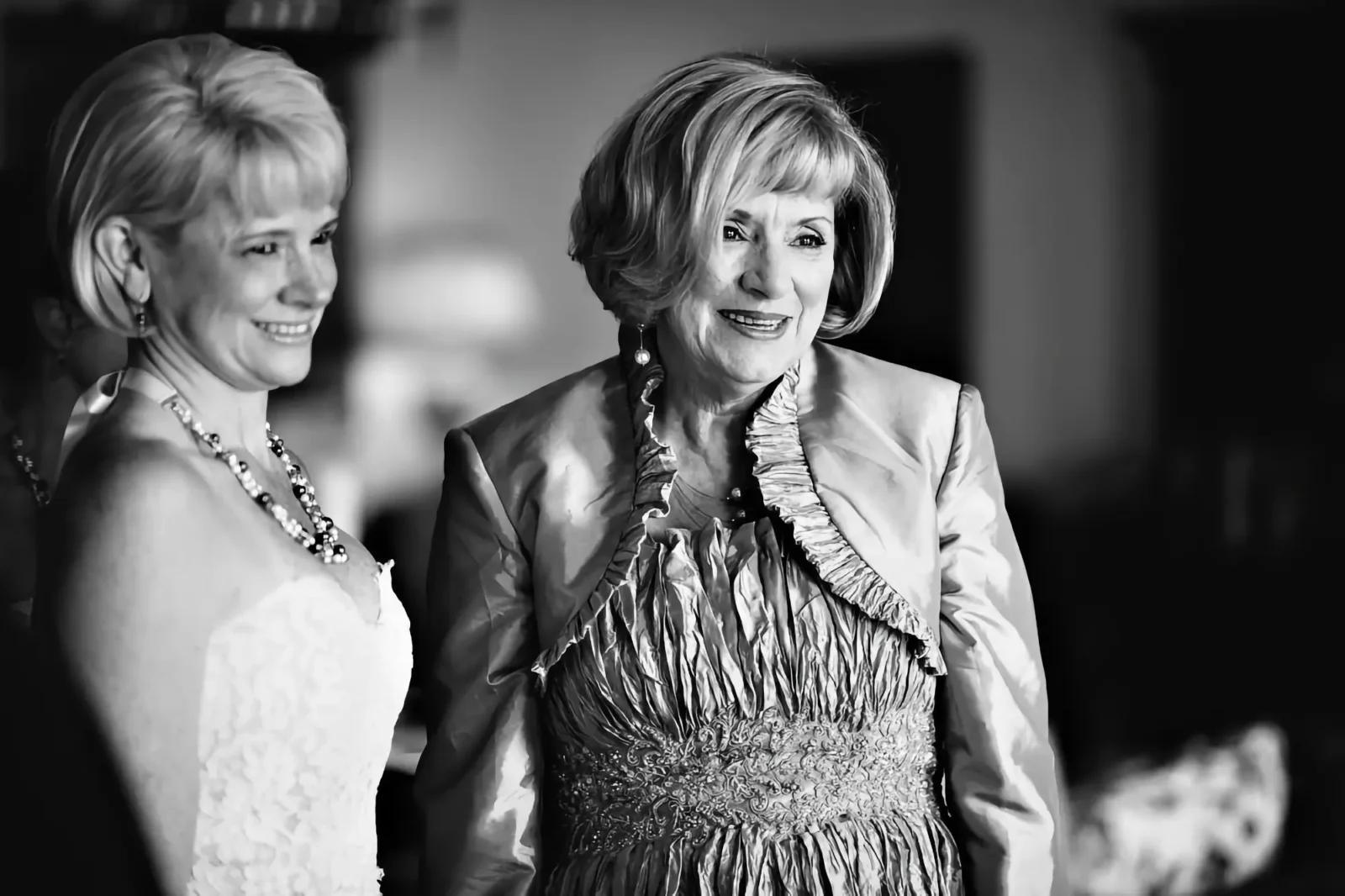 Penny VanNortwick; beautiful older woman with short hair wearing a mother-of-the-bride dress.